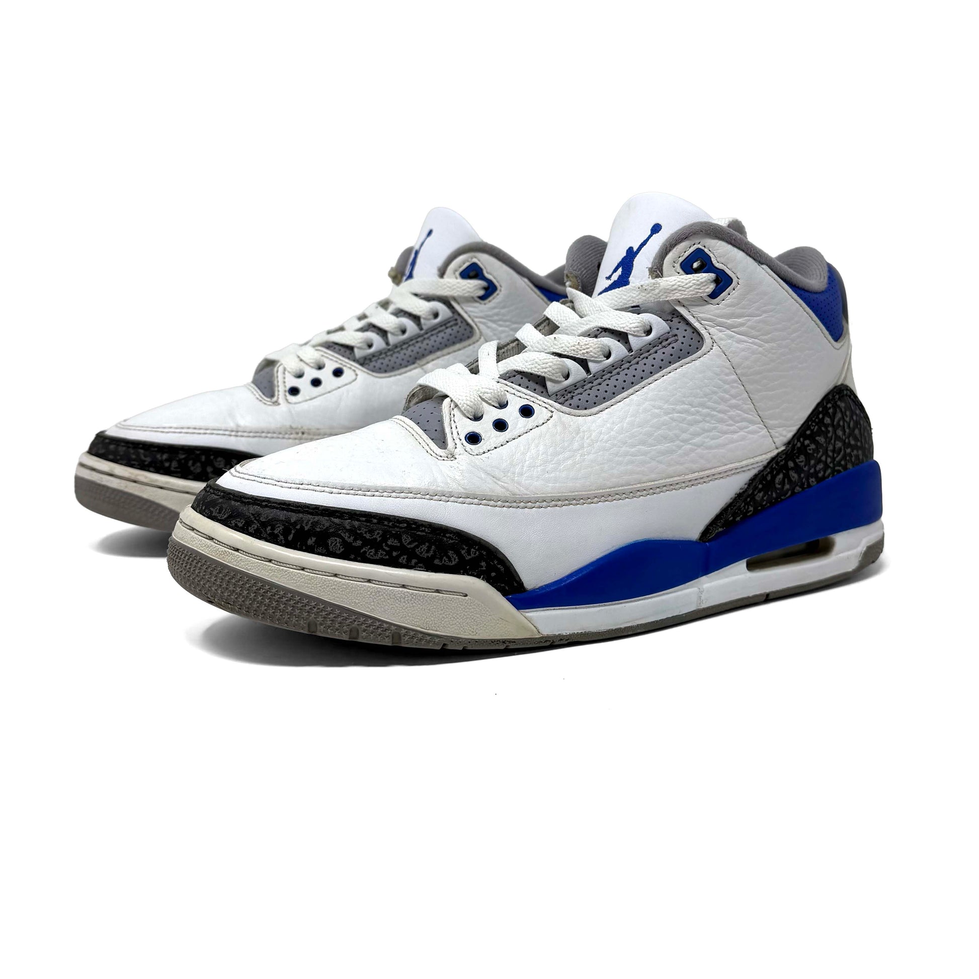 White sneakers with blue and gray accents on a white background