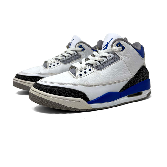 White sneakers with blue and gray accents on a white background