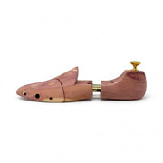 Horizontal side profile of cedar wood shoe tree highlighting expandable twin-tube brass mechanism