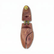 Top-down view of premium cedar shoe tree showing natural wood grain and split-toe shaper